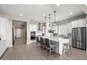 Bright kitchen features white cabinets, stainless steel appliances, and an island at 6607 E Libby St, Phoenix, AZ 85054