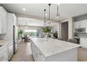 Open concept kitchen boasting a spacious island and high-end finishes at 6607 E Libby St, Phoenix, AZ 85054