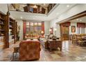 Bright and airy living room with soaring ceilings, comfortable furnishings, and mountain views at 8260 E Sunset View Dr, Gold Canyon, AZ 85118