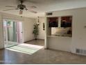 Bright living room with tile floors, sliding glass door, and a view to the patio at 8861 N 12Th Pl, Phoenix, AZ 85020