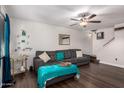 Living room with sectional sofa, wood floors, and a ceiling fan at 954 E Diamond Dr, Tempe, AZ 85283