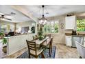 Kitchen features a dining area with a chandelier and window seat at 9553 W Deanna Dr, Peoria, AZ 85382