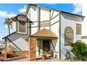 Front entrance with brick pillars, a covered porch, and potted plants at 1112 W Citation Dr, Chandler, AZ 85224