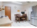 Cozy dining area with wood table and chairs at 11217 W Missouri Ave, Youngtown, AZ 85363