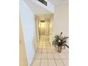 Bright hallway with tile flooring and a decorative plant at 12226 N Lakeforest Dr, Sun City, AZ 85351