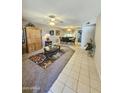 Spacious living room featuring tile floors and a large window at 12226 N Lakeforest Dr, Sun City, AZ 85351