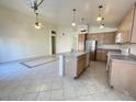 Kitchen boasts an island and ample cabinet space at 1324 W Michigan Ave, Phoenix, AZ 85023