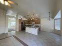 Open kitchen with an island and stainless steel appliances at 1324 W Michigan Ave, Phoenix, AZ 85023