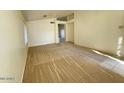 Bright and airy living room with neutral carpeting at 1324 W Michigan Ave, Phoenix, AZ 85023