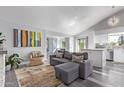 Open living area with a gray sectional sofa and views into the kitchen at 14667 N Love Ct, Fountain Hills, AZ 85268