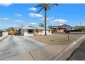 Newly remodeled home with a clean, modern design and driveway at 1510 E Mission Ln, Phoenix, AZ 85020