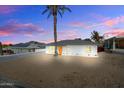 Front view of a renovated single-story home with a landscaped yard at 1510 E Mission Ln, Phoenix, AZ 85020