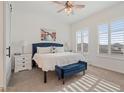 Spacious bedroom with plush bedding, large windows, and stylish decor at 15550 S 5Th Ave # 240, Phoenix, AZ 85045