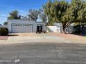 Single story home with attached garage and landscaping at 1714 N Pleasant Dr, Chandler, AZ 85225