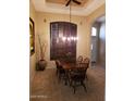 Dining room with wood table, chairs, and chandelier at 17906 N Encanto Dr, Surprise, AZ 85374