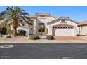 Charming single-story home with desert landscaping, a two-car garage, and a welcoming entryway, set in a quiet neighborhood at 17906 N Encanto Dr, Surprise, AZ 85374