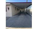 Covered carport with screened sides and a paved driveway at 3104 E Broadway -- # 88, Mesa, AZ 85204