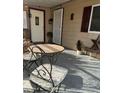 Small front porch with wrought iron table and chairs at 3104 E Broadway -- # 88, Mesa, AZ 85204