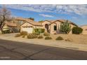 Tan house exterior with cacti and a two-car garage at 3404 E Los Altos Rd, Gilbert, AZ 85297