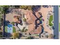 Aerial view of the property showing the tile roof and basketball court at 4245 E Claremont Ave, Paradise Valley, AZ 85253