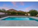 Inviting swimming pool in a backyard setting with mountain views at 4450 N 54Th St, Phoenix, AZ 85018