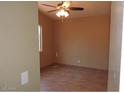 Bright bedroom with ceiling fan and tile flooring at 510 E Wickieup Ln, Phoenix, AZ 85024