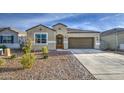 Welcoming single-story home with a cozy entrance and a convenient two-car garage at 5267 E Diatomite Dr, San Tan Valley, AZ 85143