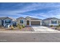 Attractive single-story home featuring desert landscaping for low maintenance appeal at 5267 E Diatomite Dr, San Tan Valley, AZ 85143