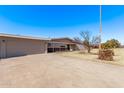 Ranch home with attached two-car garage and long driveway at 530 N Miller St, Mesa, AZ 85203