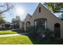 Beautiful home with lush landscaping, an arched driveway, and a welcoming front exterior at 537 W Encanto Blvd, Phoenix, AZ 85003