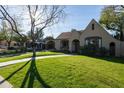 Charming home with a well-manicured lawn, inviting walkway, and classic architectural details at 537 W Encanto Blvd, Phoenix, AZ 85003