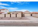 Desert home features a tile roof, a two car garage and gated, private front courtyard at 5421 W Brown St, Glendale, AZ 85302