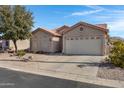 House exterior showcasing a two-car garage and well-maintained yard at 6871 S Coral Gable Dr, Chandler, AZ 85249