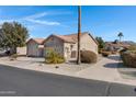 Exterior view of the home with a side yard and walkway at 6871 S Coral Gable Dr, Chandler, AZ 85249