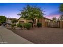 Side view of a house with stone accents and desert landscaping at 7635 W Rock Springs Dr, Peoria, AZ 85383