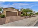 House exterior featuring a brown garage door and well-manicured landscaping at 7635 W Rock Springs Dr, Peoria, AZ 85383