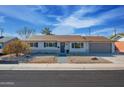 Charming single-story home with landscaped yard and attached garage at 8413 E Sheridan St, Scottsdale, AZ 85257