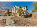 Two story home on landscaped lot with desert landscaping and two car garage and sidewalk at 852 E Gary Ln, Phoenix, AZ 85042