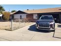 Ranch style home with attached garage and front yard at 921 S Pioneer --, Mesa, AZ 85204