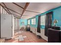 Bright room with tiled floor and window coverings at 10126 W Sun City Blvd, Sun City, AZ 85351