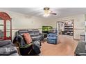 Living room with hardwood floors and comfy seating at 10126 W Sun City Blvd, Sun City, AZ 85351