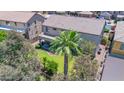 House with a large backyard, palm tree, and patio at 11050 E Ravenna Ave, Mesa, AZ 85212