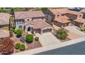 Two-story house with a two-car garage and manicured lawn at 11050 E Ravenna Ave, Mesa, AZ 85212