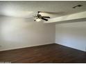Spacious living room featuring wood floors and a ceiling fan at 1550 N Stapley Dr # 35, Mesa, AZ 85203