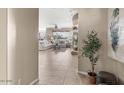 View from entryway into living room with tile floors at 16115 W Vale Dr, Goodyear, AZ 85395