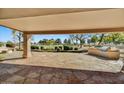 Relaxing flagstone patio with built-in grill and scenic backyard view at 19401 N 86Th Dr, Peoria, AZ 85382