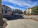 Community view showing homes with a curved street at 2215 S Harper --, Mesa, AZ 85209