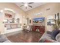 Cozy living room with vaulted ceiling, hardwood floors, and inviting decor at 22415 N 34Th Ln, Phoenix, AZ 85027