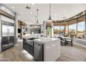 Gourmet kitchen with stainless steel appliances and large island at 23238 N 94Th Pl, Scottsdale, AZ 85255