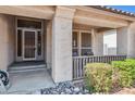 Inviting front porch with decorative rock, leading to a secure front door and offering a cozy outdoor space at 31016 N 42Nd Way, Cave Creek, AZ 85331